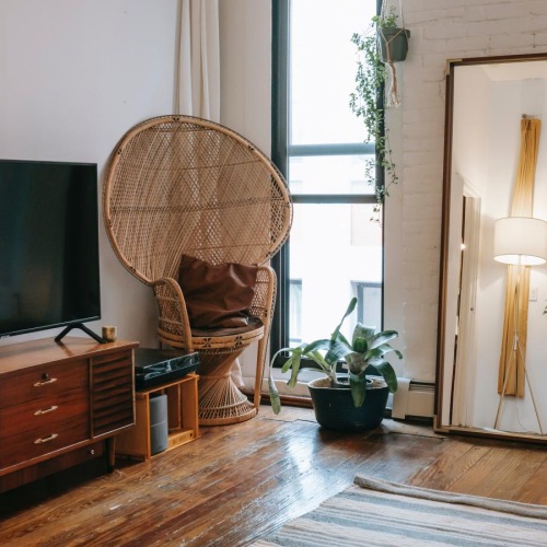 a living room with a tv and a chair