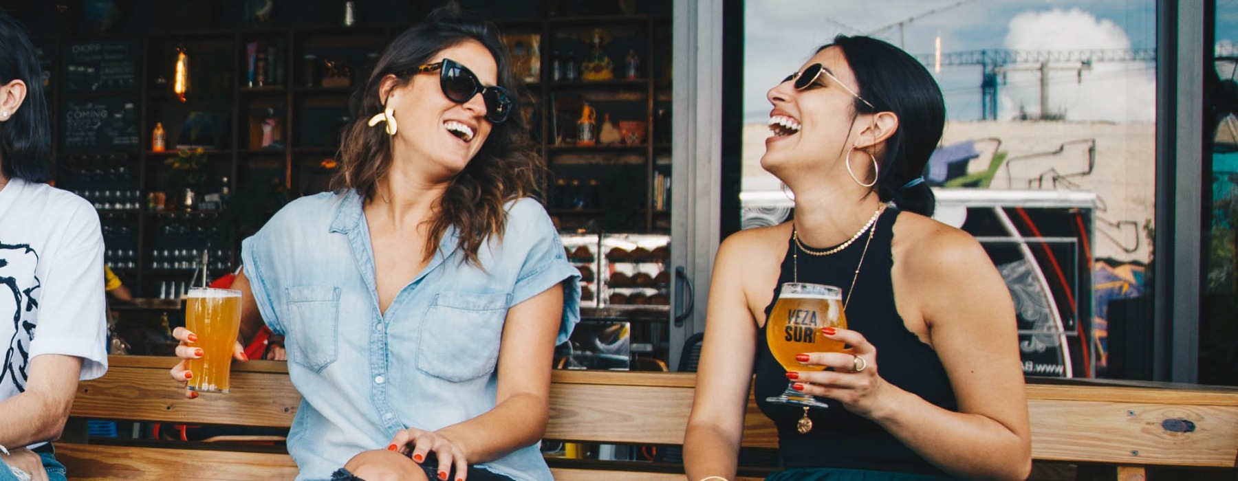 women having drinks outside of a restuarant