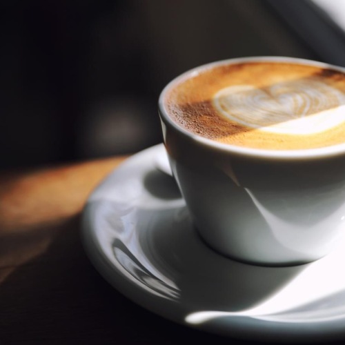 a cup of coffee on a saucer
