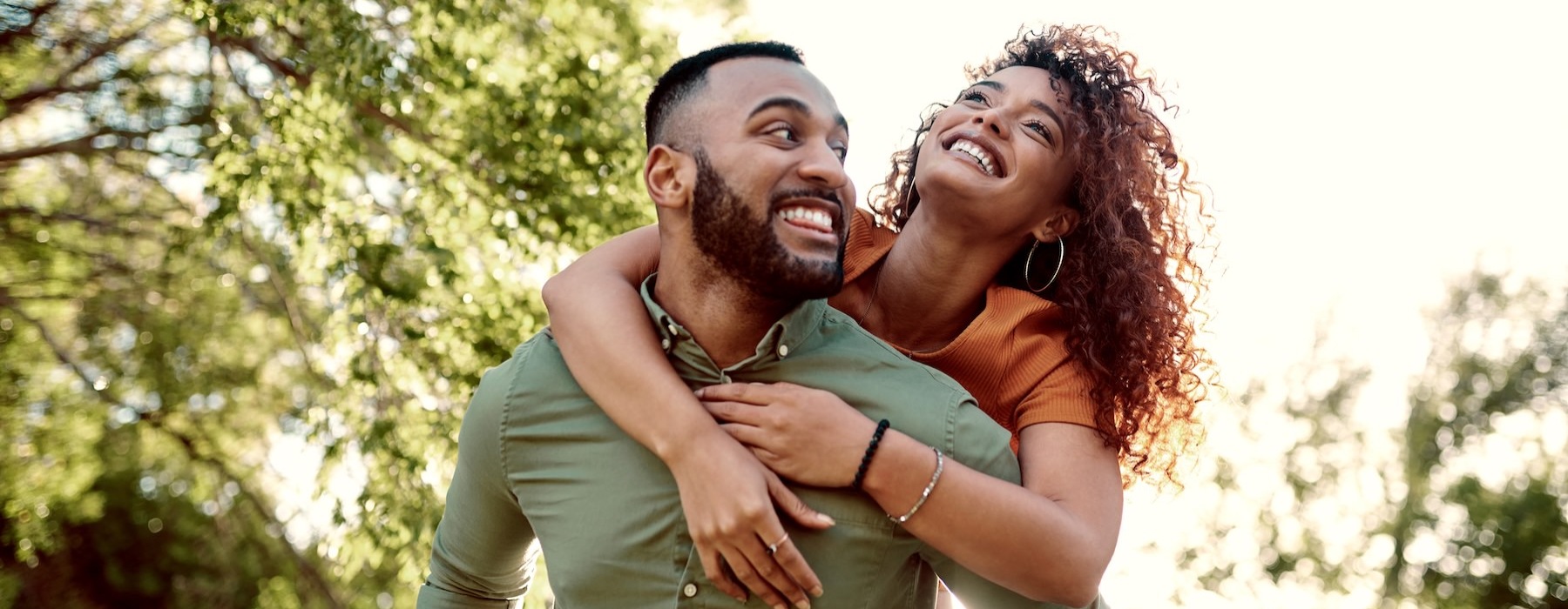 a man giving a woman a piggyback ride